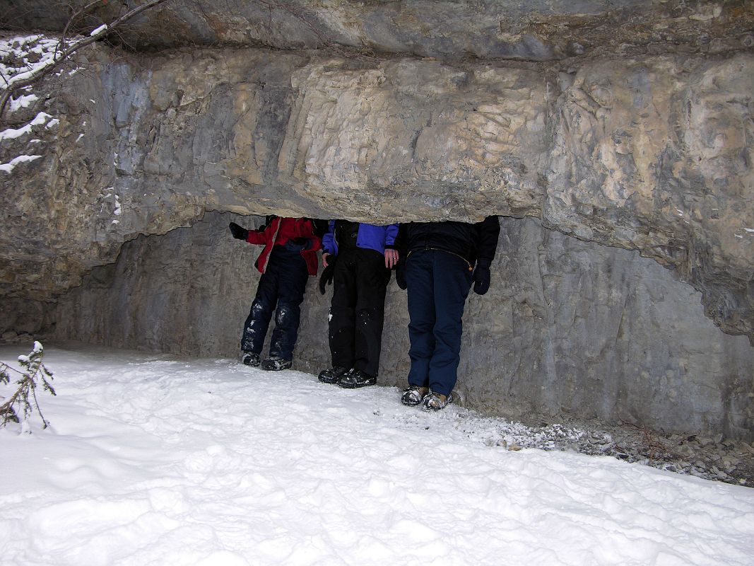 08 Peter Ryan, Jerome Ryan and Charlotte Ryan With Heads in Cave At Banff Grotto Canyon In Winter